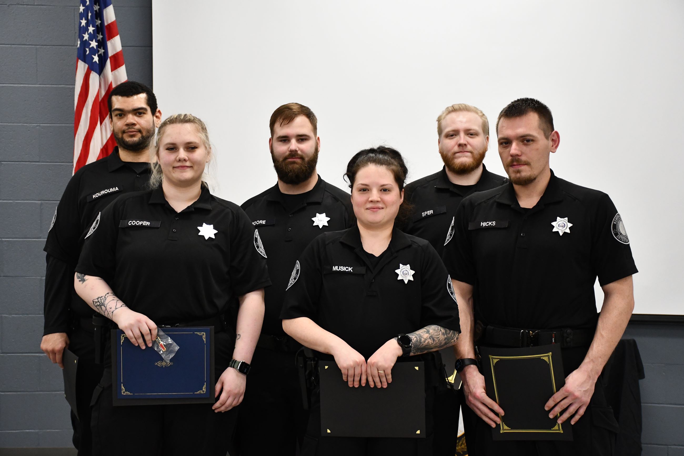 Six KCDC deputies stand together