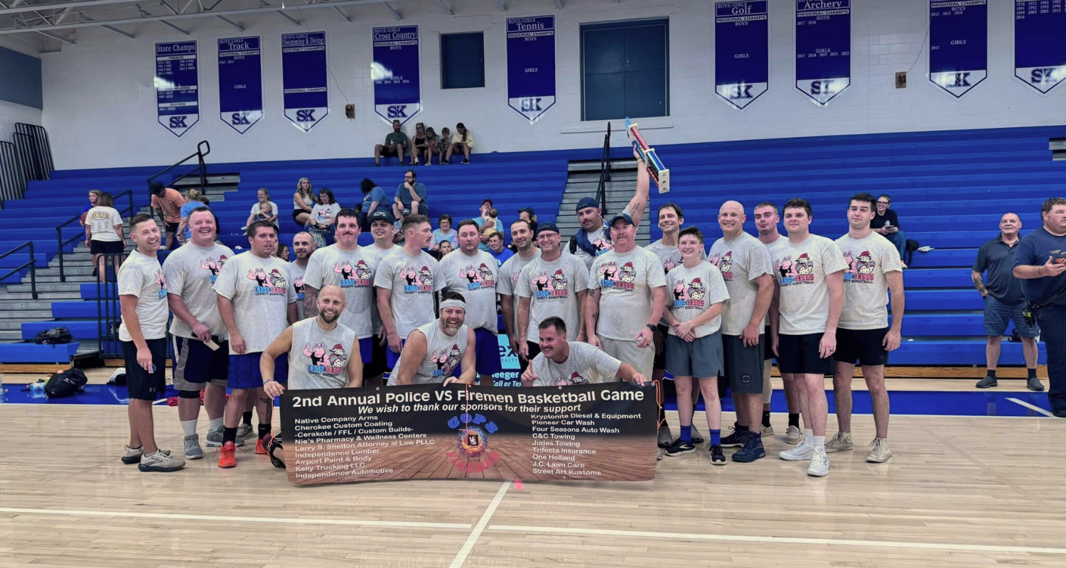 Group photo after police v. firefighters game